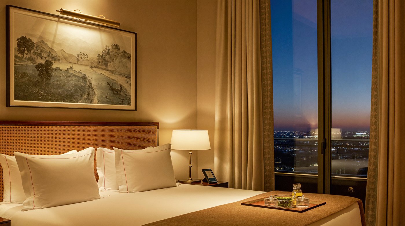 A made-up bedroom in an upmarket hotel suite